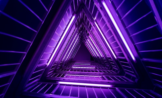 A hallway with uv tube lights in a triangular pattern. Photo by [Sandro Katalina](https://unsplash.com/@jensth?utm_content=creditCopyText&utm_medium=referral&utm_source=unsplash) on [Unsplash](https://unsplash.com/photos/purple-and-black-pyramid-wallpaper-k1bO_VTiZSs?utm_content=creditCopyText&utm_medium=referral&utm_source=unsplash)
